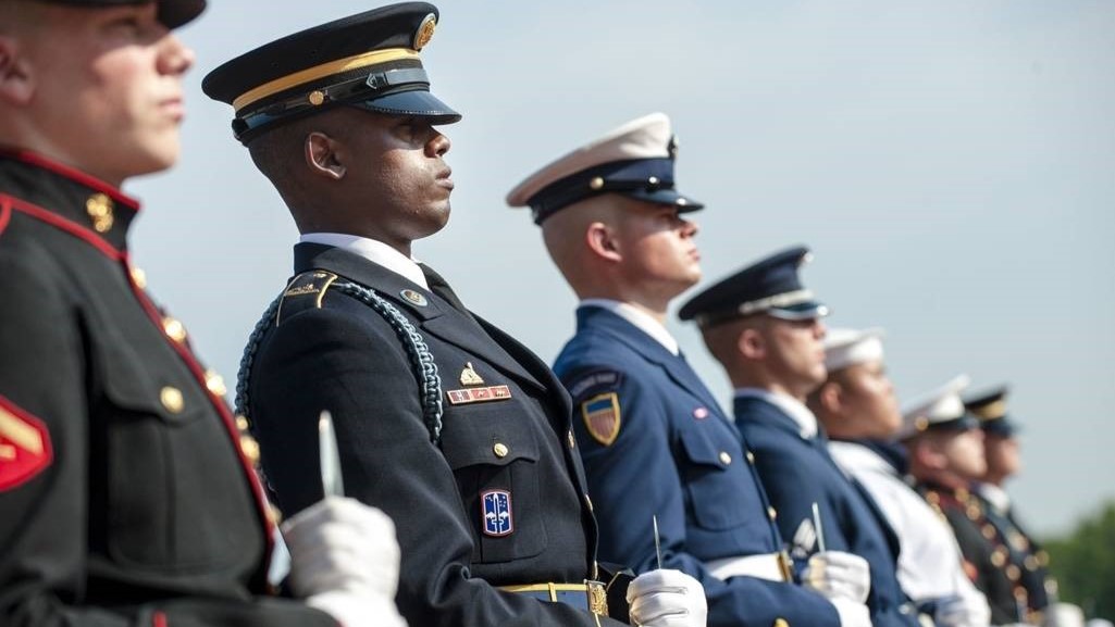 Veterans from various branches of the United States military standing in line